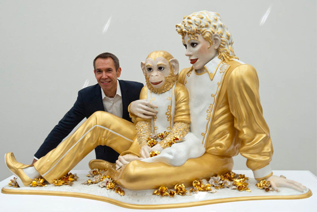 Koons poses with his 1988 work Michael Jackson and Bubbles