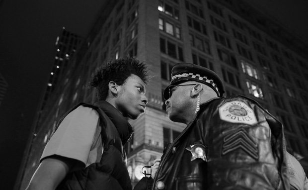 John J. Kim, USA, 2015, Chicago Tribune, March Against Police Violence Lamon Reccord stares down a police sergeant during a protest following the fatal shooting of Laquan McDonald by police in Chicago, Illinois, USA, 25 November 2015.