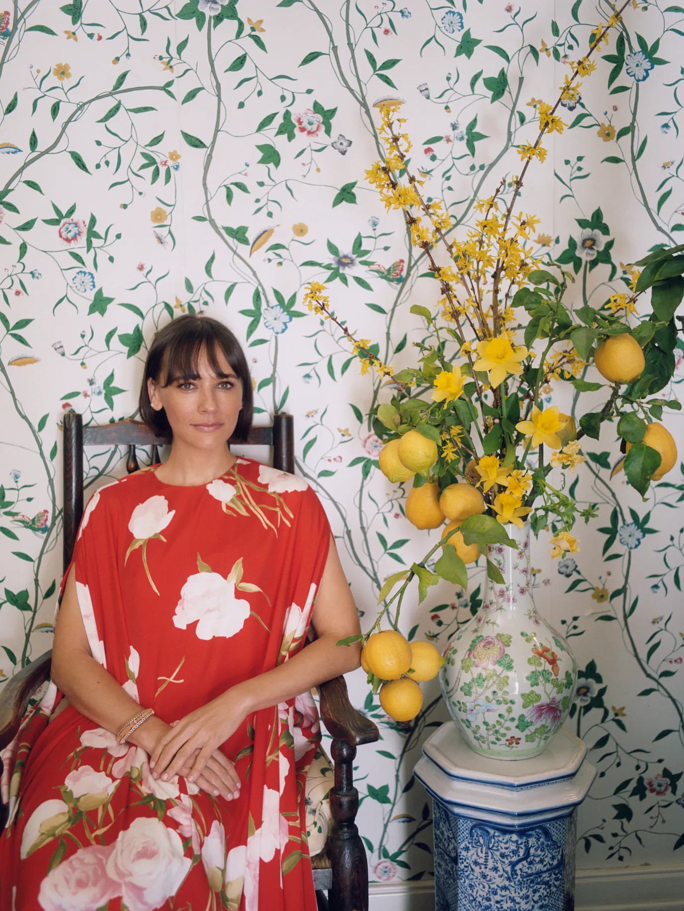 Rashida Jones beside the Putnams' floral display in W Magazine. Photograph by Zoë Gherner. Jones wears a Valentino dress; Cartier bracelet; her own earrings.