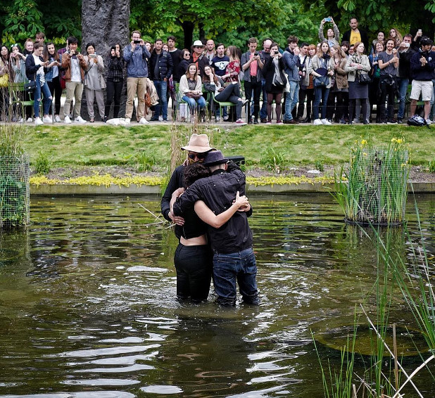 Win Butler, Régine Chassagne and JR in the lake at the Jardin des Tuileries, Paris. Image courtesy of JR's Instagram