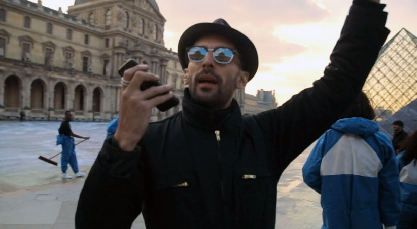 JR at work at the Louvre. From his new documentary