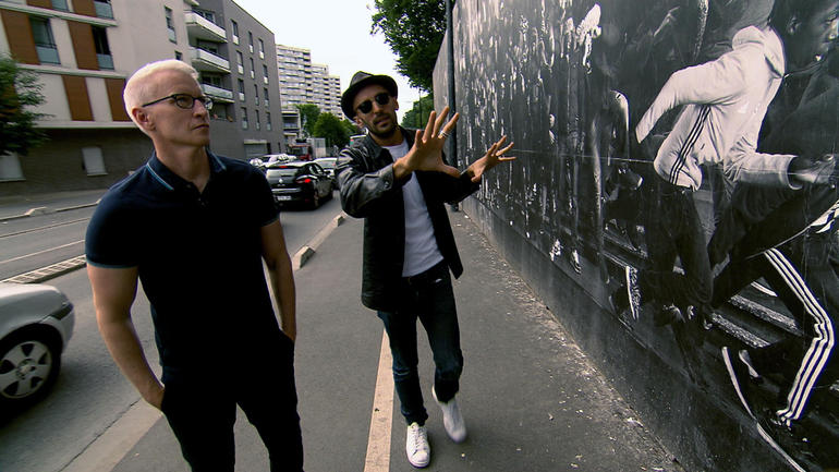 Anderson Cooper and JR on 60 Minutes. Image courtesy of CBS