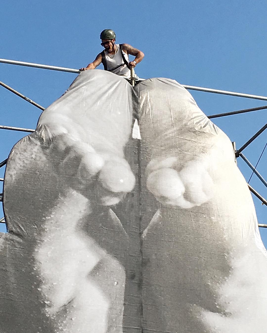 JR's team install a new piece in Rio. Image courtesy of the artist's Instagram