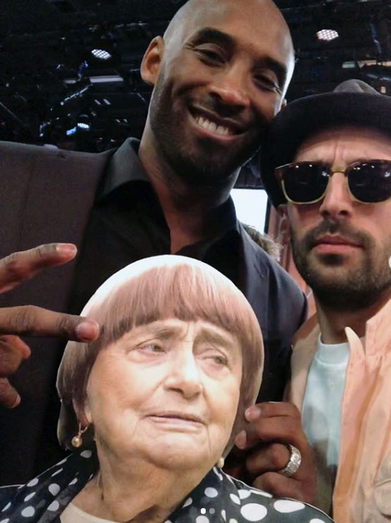 Kobe Bryant with JR and his cardboard cutout of Agnès Varda at the Oscars luncheon in Los Angeles, 2018. Image courtesy of JR's Instagram
