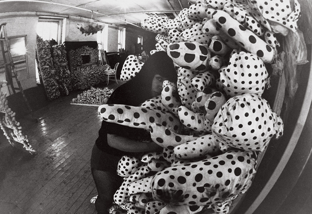 Yayoi Kusama with Accumulation pieces at her studio in New York (c.1963-64)