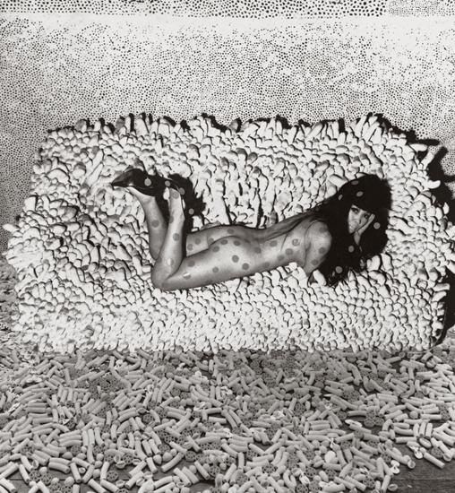 Yayoi Kusama, c. 1966 with one of her Infinity Net paintings