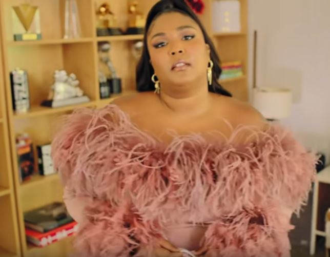 Lizzo in her LA home with her copy of Phaidon's 
Rihanna book (bottom left). Image courtesy of Vogue's Youtube channel