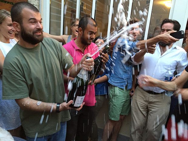 Nominee Lorenzo Meloni sprays the celebratory champagne at Magnum Photos' 2015 AGM. © Jean Gaumy/Magnum Photos