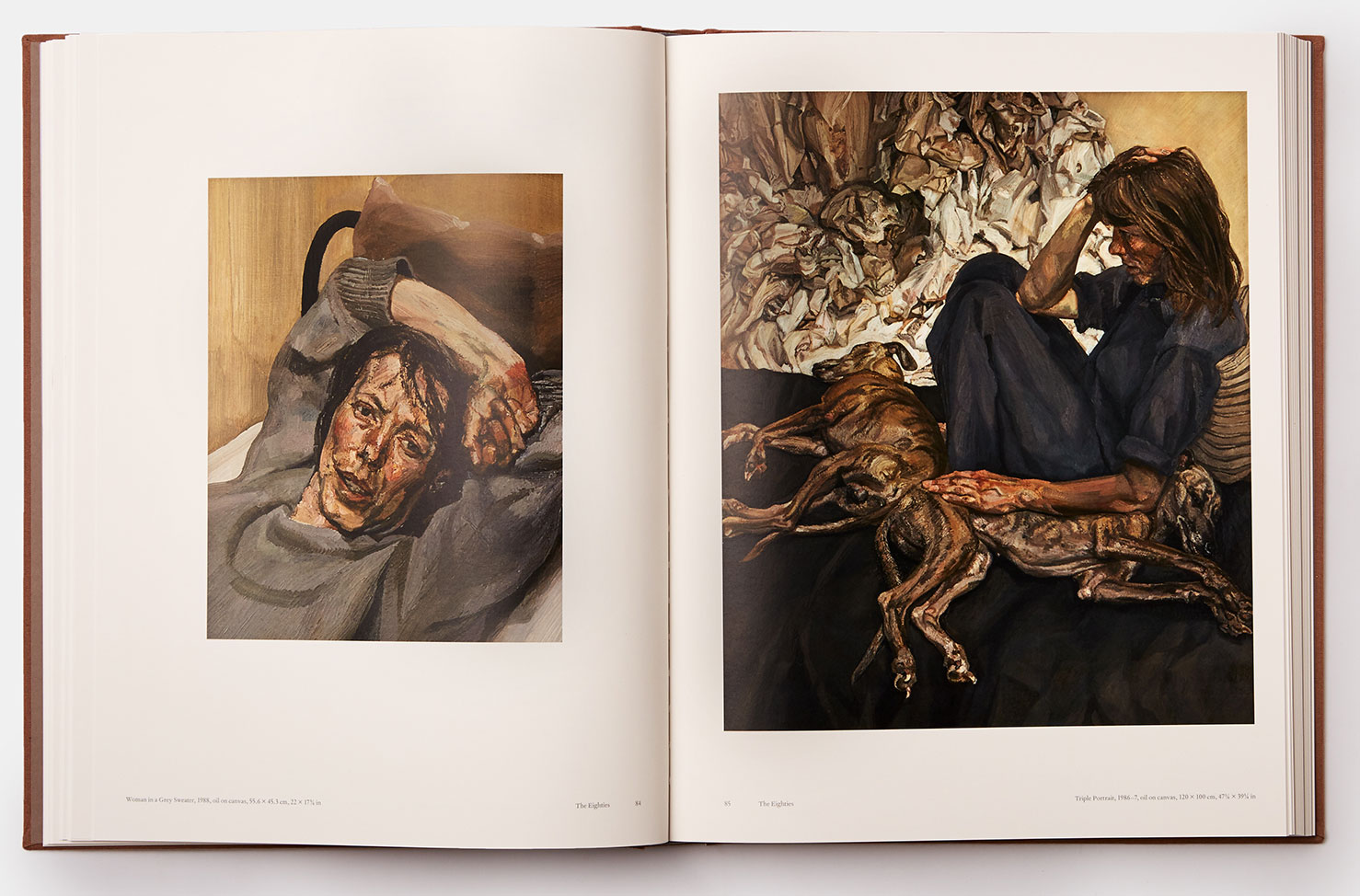 A spread from volume two of our Lucian Freud book, featuring Triple Portrait (right, 1986–7), one of Freud's human and animal portraits