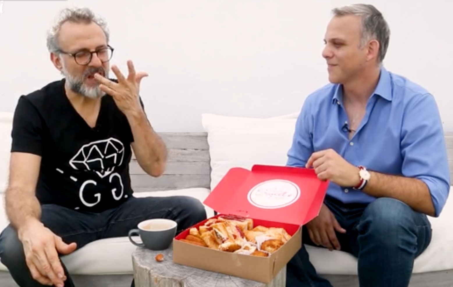 Massimo (left) tries some Cuban pastelitos, courtesy of the Miami Herald's Carlos Frías (right)