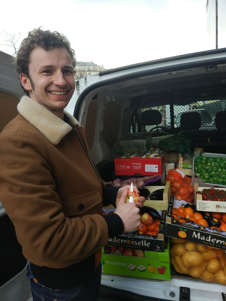 The new Refettorio's chef Maxime with donated ingredients. Image courtesy of Food for Soul's Instagram