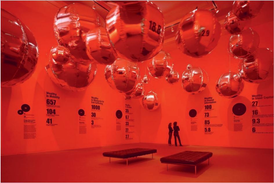 An installation view of Bruce Mau's Massive Change exhibition, as reproduced in Bruce Mau: MC24