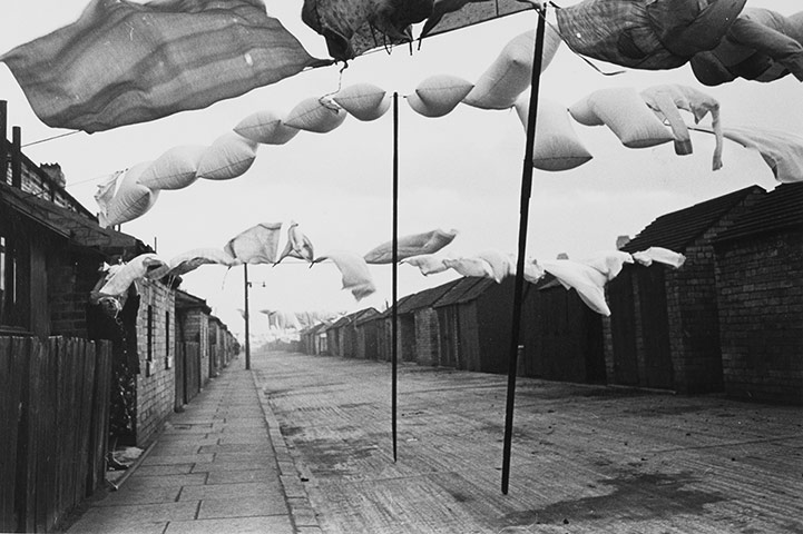 Humphrey Spender Ashington – Washing in road between terraced housing, 1937/38 © Bolton Council, from the Collection of Bolton Library and Museum Services Courtesy of the Mass Observation Archive