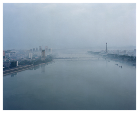 The Juche tower on the Taedong river represents the ideology developed by Kim Il Sung. It was designed by Kim Jong Il for his father's 70th birthday.  Each of its 25 500 white granite blocks represents a day of his life until his that day. Photograph by Maxime Delvaux 