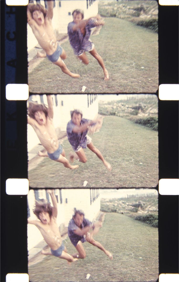 Peter Beard and John F. Kennedy Jr. enacting a Hollywood-movie-style fistfight, Montauk, August 1972