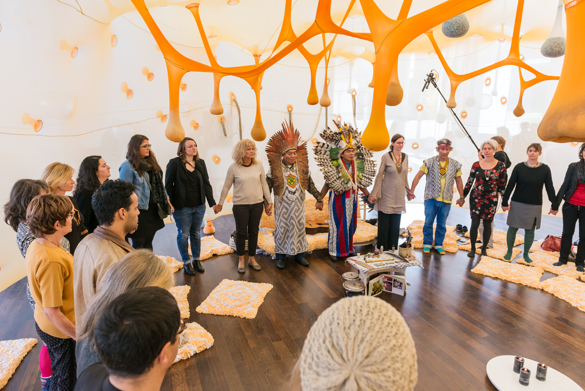 Paxpa – There is a Forest encantada inside of us, 2014 Material: cotton fabric, polyamide fabric, sand, marble, raffia, plywood, mountain crystal, amethyst, amazonite, glass beads, vinyl balls, cloves, pepper, curcuma, ginger, lavender, musical instruments, candles Dimensions: 480 x 1016 x 1245 cm Installation view at Arp Museum Bahnhof Rolandseck