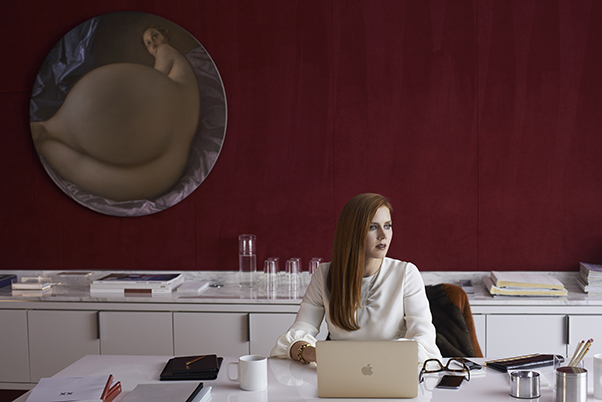 Amy Adams in Nocturnal Animals, beside a John Currin painting. Photograph by Merrick Morton, courtesy of Focus Features