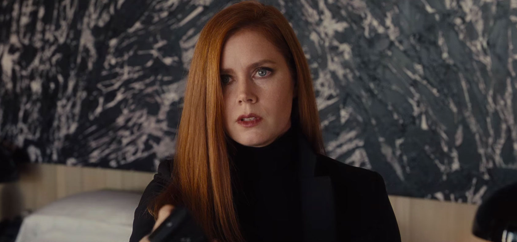 Mark Bradford's work behind Amy Adams in Nocturnal Animals.