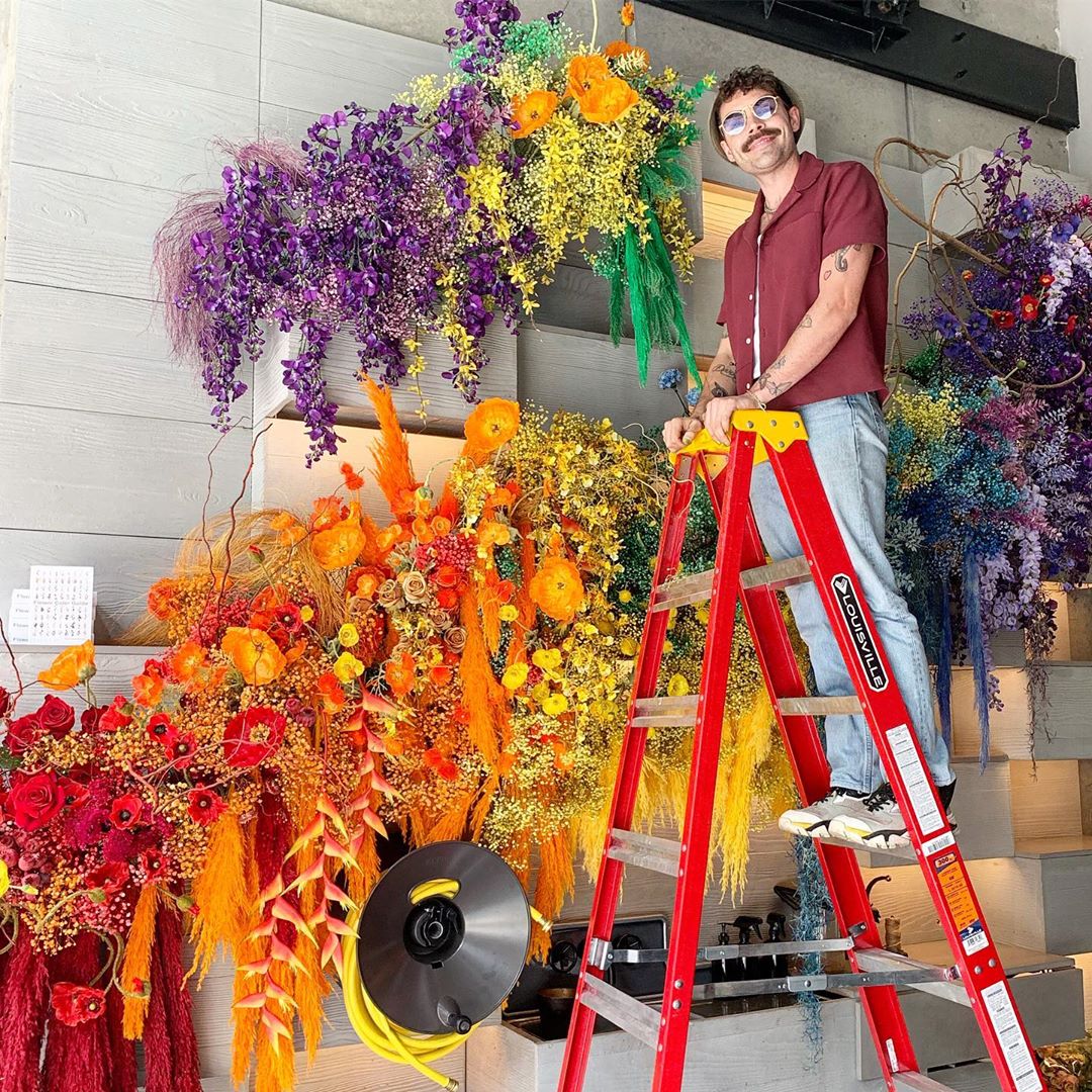 Michael Putnam with part of his rainbow display. Image courtesy of Putnam & Putnam's Instagram