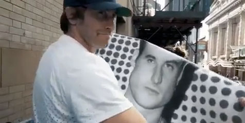 Gyllenhaal with a poster featuring his co-star Tom Sturridge, outside the Hudson Theatre in New York 