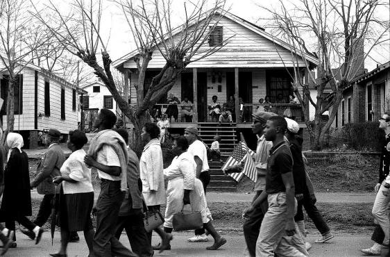 Marchers on the way to Montgomery as families watch from their porches