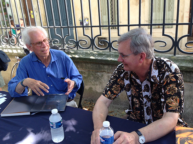 Stephen Shore and Martin Parr chat during a signing session at the Rencontres d’Arles