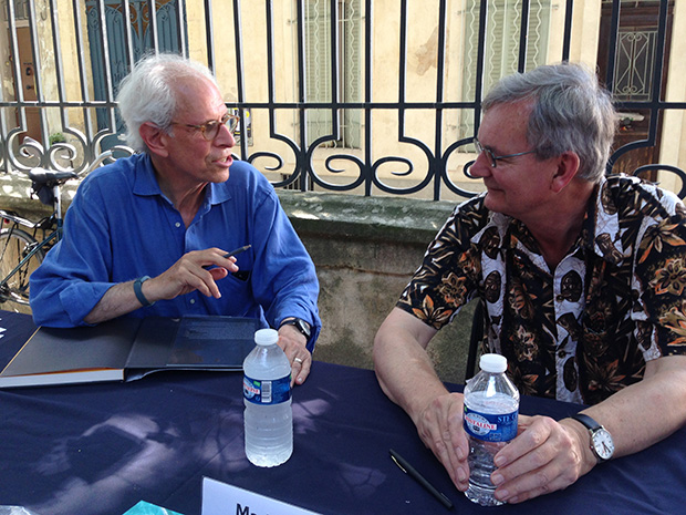 Stephen Shore and Martin Parr chat during a signing session at the Rencontres d’Arles
