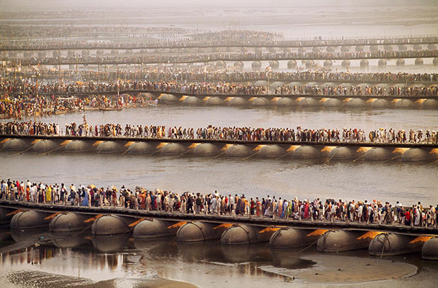 Crowds gather for the Kumbh Mela festival on temporary pontoon bridges across the River Ganges - Steve McCurry from the book India