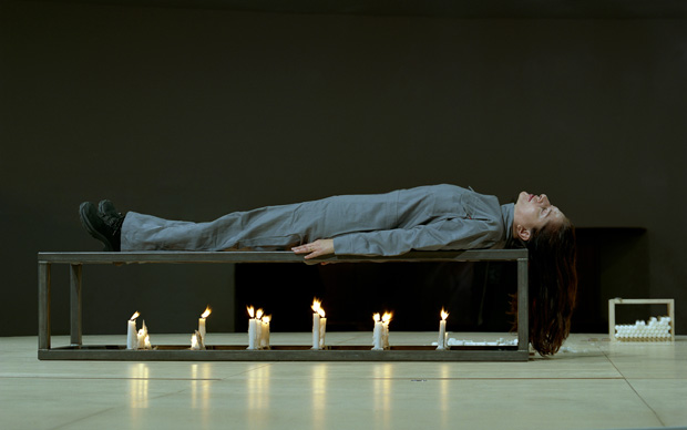 Marina Abramovic performing Gina Pane’s Conditioning, first action of Self-Portraits (1973) at the Solomon R. Guggenheim Museum on November 12, 2005