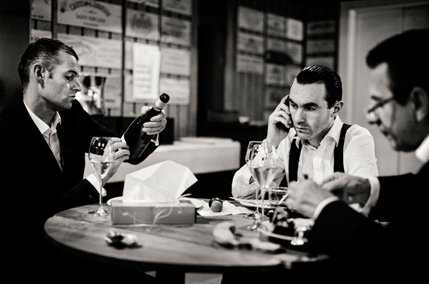 Goodfellas: Sommeliers Sébastien Schaer, Patrice Fournier, and Denis Bertrand eat in the wine cellar of Maison Pic - photograph by Per-Anders Jörgensen