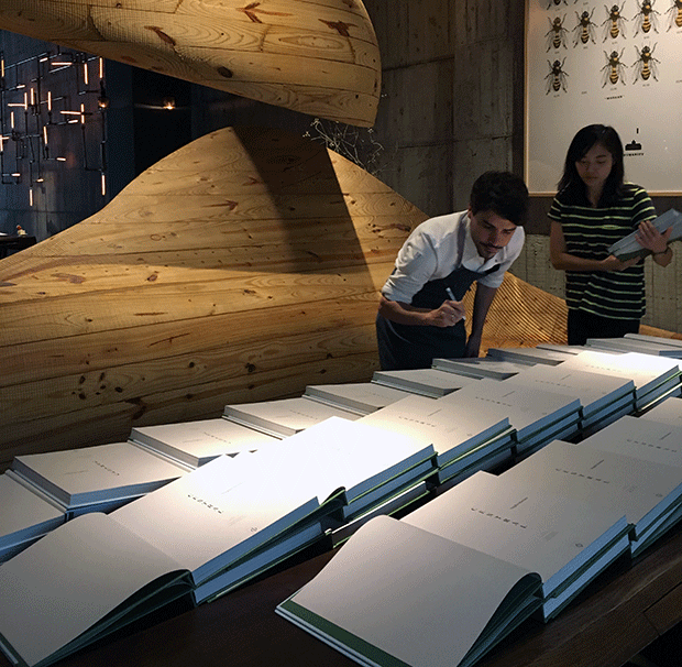 Virgilio signing copies of his book Central