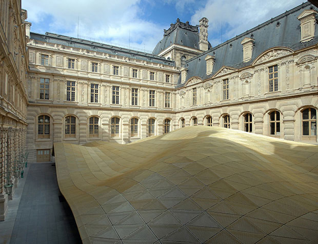 Louis Vuitton inserts a yellow racetrack at the Louvre for Spring