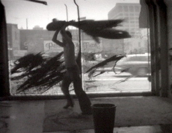 Whipping a Window and a Wall with Paint (1974) by Paul McCarthy
