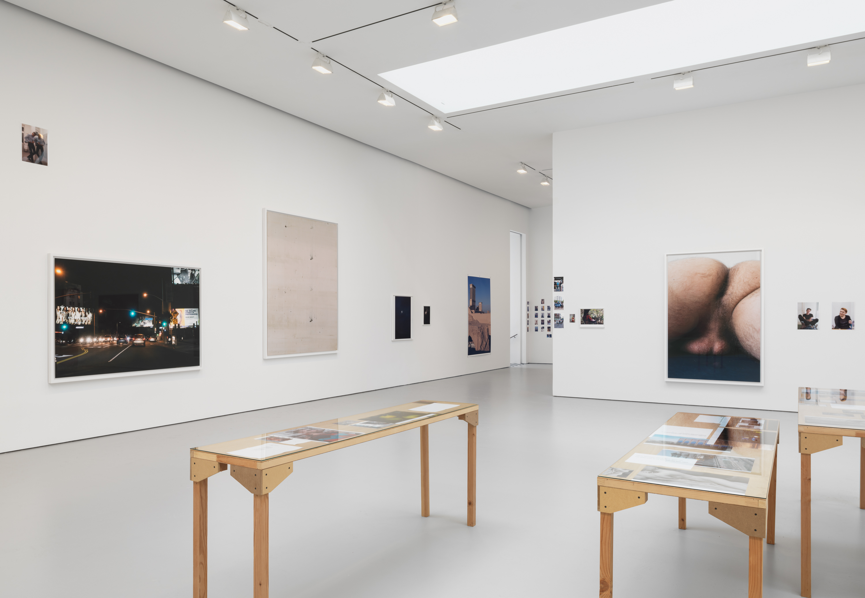 Installation view from the 2015 solo exhibition PCR at David Zwirner, New York. Nackt, 2, (2014), by Wolfgang Tillmans can be seen on the far wall. Courtesy David Zwirner, New York