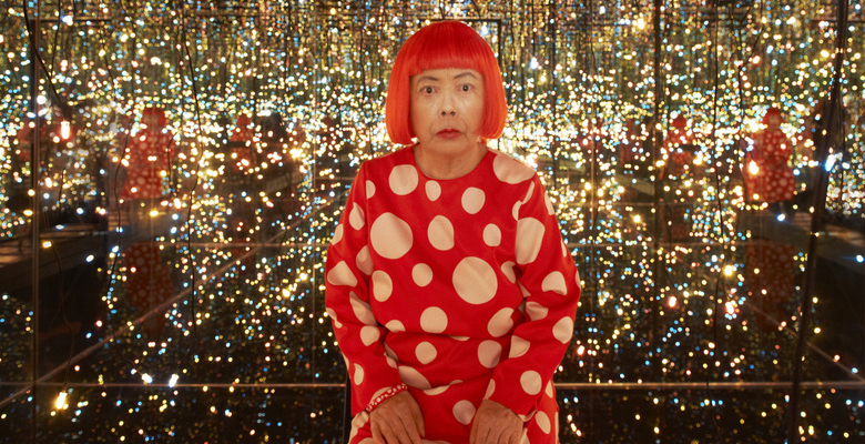 Yayoi Kusama inside one of her Infinity Rooms